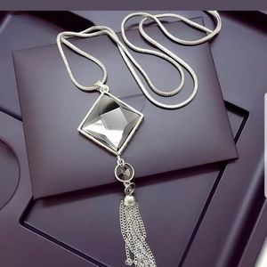 Big crystal pendant with long silver chain